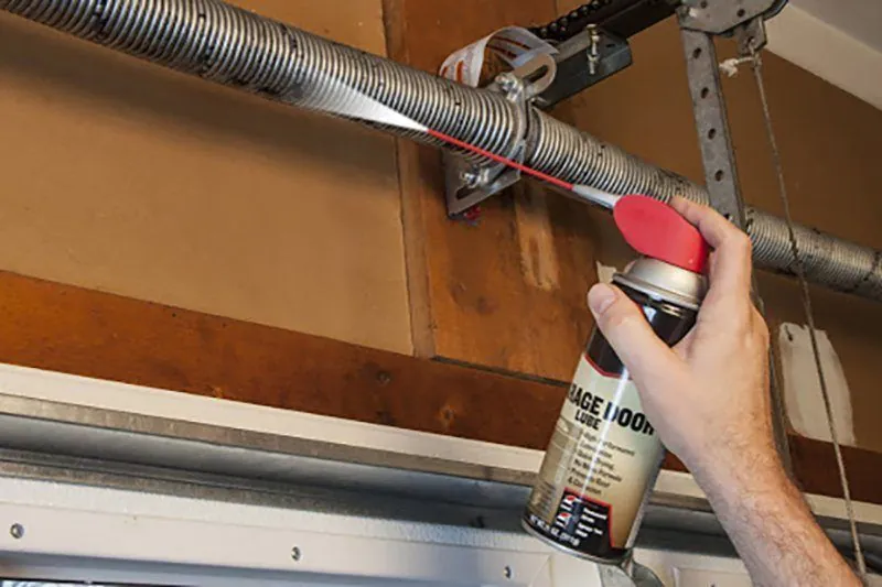 Garage door lubrication tune-up maintenance service